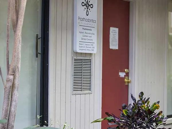 The sign outside Suite B-4, naming Dr. Isaacson, Dr. Reinhardt and Dr. Milone.