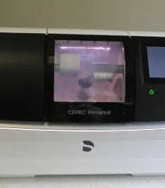 The practice's CEREC Primemill, which mills porcelain crowns in the office.